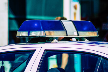 Closeup of an official police car patrolling the streets of the city center of the metropolitan area
