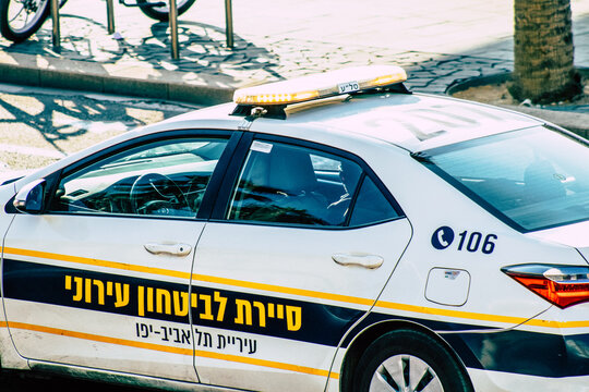 Closeup of an official police car patrolling the streets of the city center of the metropolitan area
