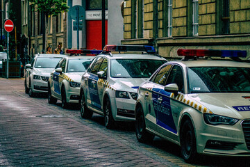 Closeup of an official police car patrolling the streets of the city center of the metropolitan area
