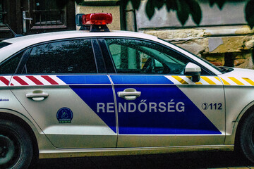 Closeup of an official police car patrolling the streets of the city center of the metropolitan...