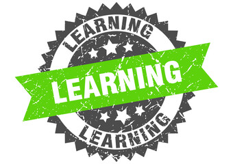 learning stamp. grunge round sign with ribbon