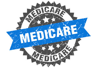medicare stamp. grunge round sign with ribbon