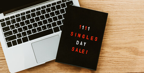 11.11 singles day flat lay with laptop on table.Singles day in 11 november in china holiday for shop and mega sale.Discount and promotion banner background template design for application and website.