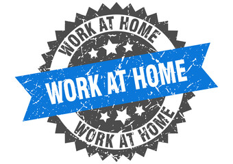 work at home stamp. grunge round sign with ribbon