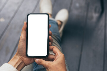cell phone mockup blank white screen.woman hand holding texting using mobile on desk at coffee shop.background empty space for advertise.work people contact marketing business,technology