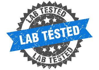 lab tested stamp. grunge round sign with ribbon