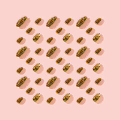 Christmas greeting card with golden pine cones. Natural toys for New Year Holidays.
