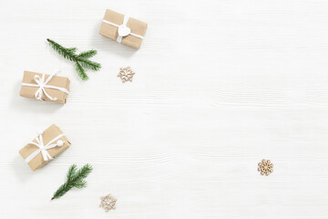 Christmas gift, wooden toys, fir tree branches, winter holiday and New Year background with copy space, handmade present for friends or family.