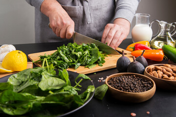 spinach and spices on the cook's table