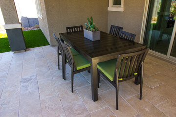 Simple Patio Table & Chairs On Rear Yard Patio
