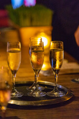 four glasses of champagne on the table