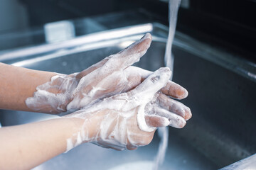 Woman hand washing with soap antibacterial for against infection germs and Coronavirus,Covid-19,hygiene concept