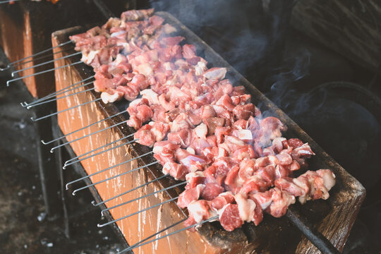 Sate Klatak grilling on charcoal grill. Sate klathak is a unique goat satay or mutton satay dish, originally from Yogyakarta, Indonesia.