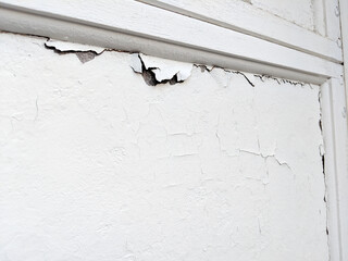 White Garage Door Panels with Old, Flaking Paint; Garage Doors that Need to Be Replaced 