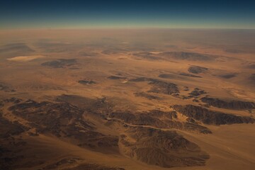 This aerial image shows a high up view of vast topography landscape.