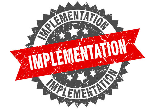 implementation stamp. grunge round sign with ribbon