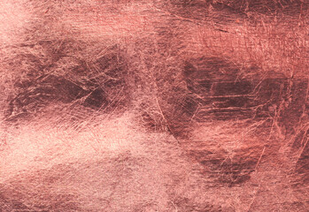 Pink gold background. Texture of gold metal