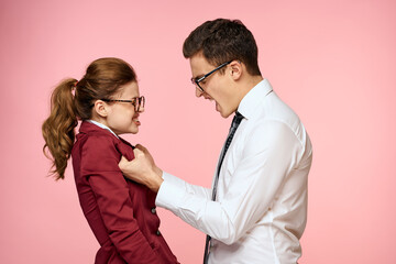 business man and woman office work colleagues team office management studio pink background