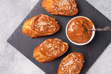 Sandwiches with baguette of bread spread with sweet paste of boiled condensed milk