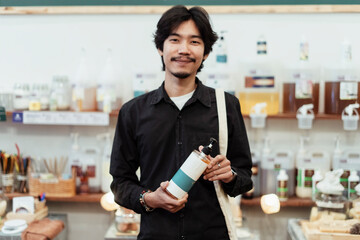 Man choosing local product in eco shop.