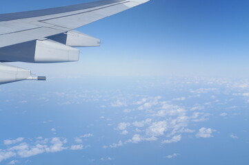 View from airplane seat of a plane wing