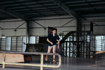 Skate board player woman stay balance on a board.