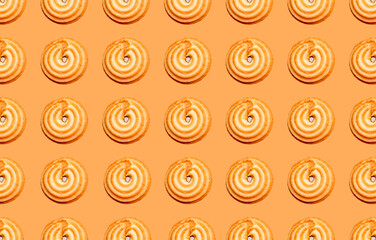 Seamless pattern with round cookies with filling on a sand-colored background.