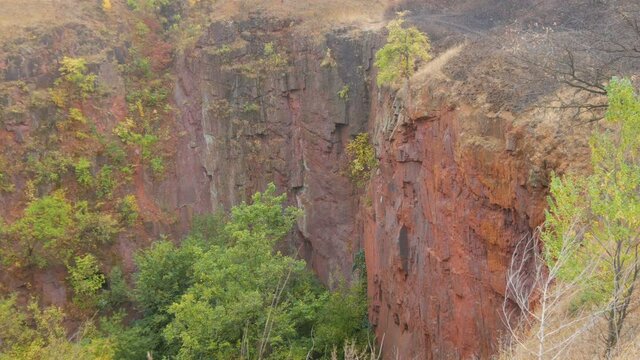 Failed quarry iron ore mine, mine construction. Industrial mining conveyor red iron ore Krivoy Rog Ukraine.