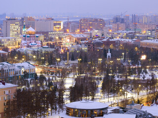 Fototapeta premium Assumption Cathedral and Dzerzhinsky Square from a height in the winter evening in Omsk. 