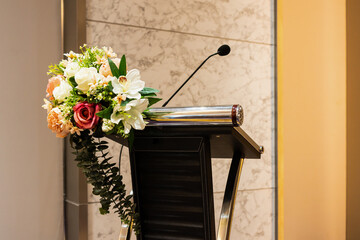 The artificial flowers at the podium in the seminar room