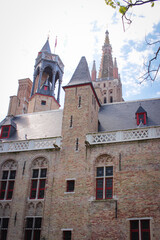 Fototapeta na wymiar Roofs And Windows Of Old Brick Houses In Bruges, Belgium