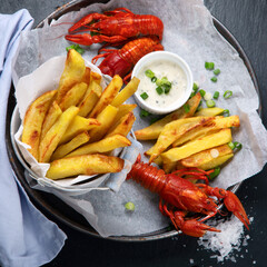 Delicious boiled crayfishes and  french fries.