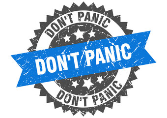 Obraz premium don't panic stamp. grunge round sign with ribbon