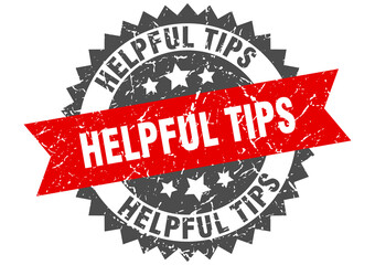 helpful tips stamp. grunge round sign with ribbon