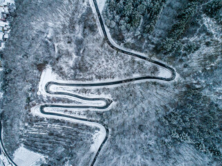 Seasons Concept winter snowy Aerial view Winding road serpentine mountain pass village Brodenbach Germany