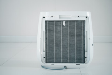 Old and dirty air purifier filter close up. HEPA Air purifier filter in modern air purifier system.