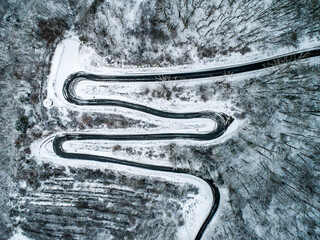 Seasons Concept winter snowy Aerial view Winding road serpentine mountain pass village Brodenbach Germany