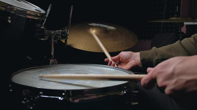  Jazz drummer hands playing at drums. Close up shot. Home lesson training.