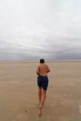 child running on the beach