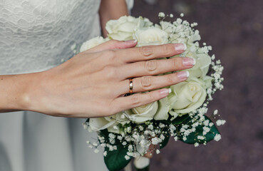 hands of young people with wedding wedding rings. wedding day details. calla flowers. spouses newlyweds groom and bride
