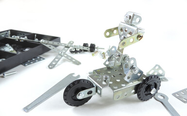   Screw driver, nuts, wrench, bolts and parts of children's metallic constructor. children's metal kit. 