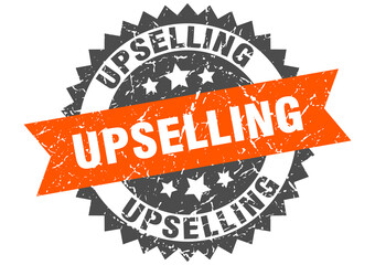 upselling stamp. grunge round sign with ribbon