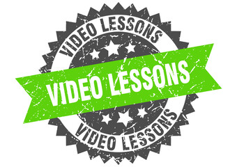 video lessons stamp. grunge round sign with ribbon