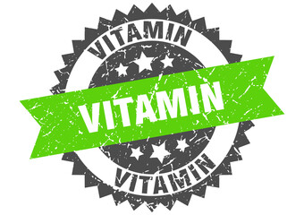 vitamin stamp. grunge round sign with ribbon