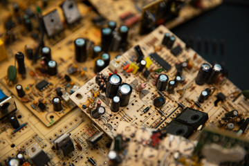 Disassembled old computers. Motherboards, power supplies, video cards, monitors. Computer trash.