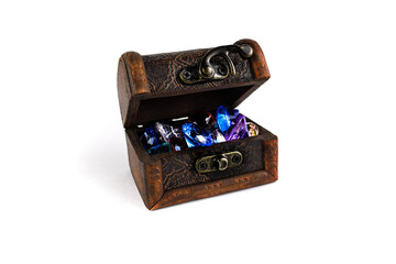 An old chest with multicolored precious stones