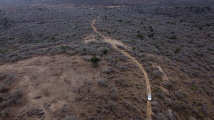 Fototapeta na wymiar Driving a 4x4 vehicle through remote wilderness in Africa