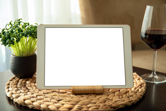 White Computer Tablet With Isolated Screen On Table With Glass