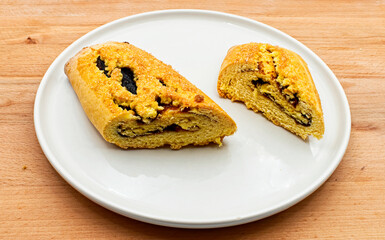Pinza bolognese, traditional italian dessert of Bologna on wooden table. Italy