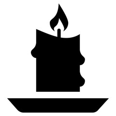 
Lit candle in a plate
